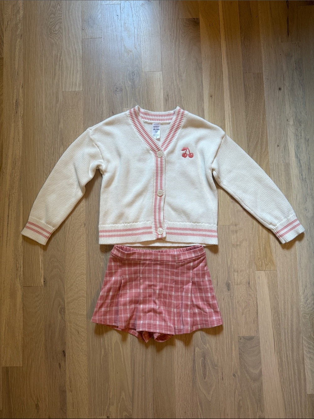 Cream Knit Cardigan with Pink Trim & EmbroideredCherry Detail + Pink Plaid Skort